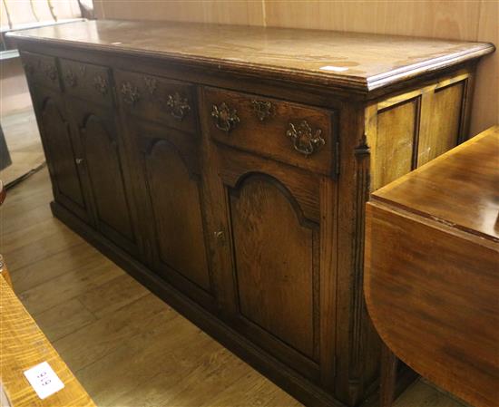 An 18th century style oak four door dresser base, W.198cms